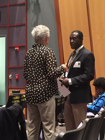 Nancy speaking with meeting chair Kwaku Ohene-Frempong